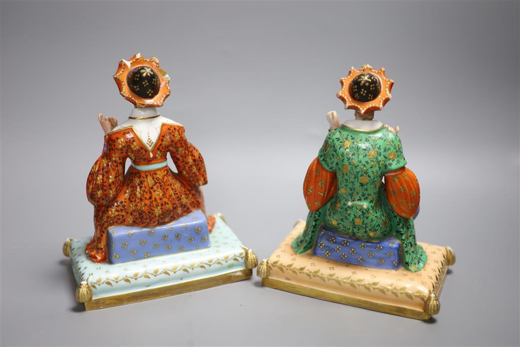 A pair of Jacob Petit mid 19th century scent bottles modelled as Ottoman Turkish seated figures, height 21cm